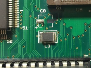 Mac Color Classic logic board showing lifted pad on capacitor C8.