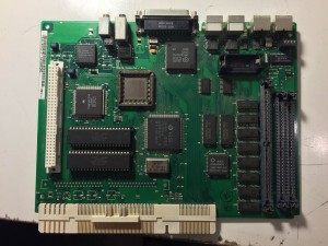 Mac Color Classic logic board with electrolytic capacitors removed.