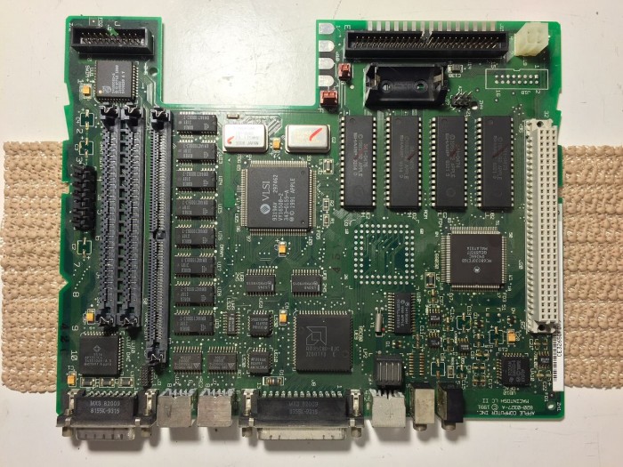Macintosh LC II/Performa 410 logic board after capacitor removal.