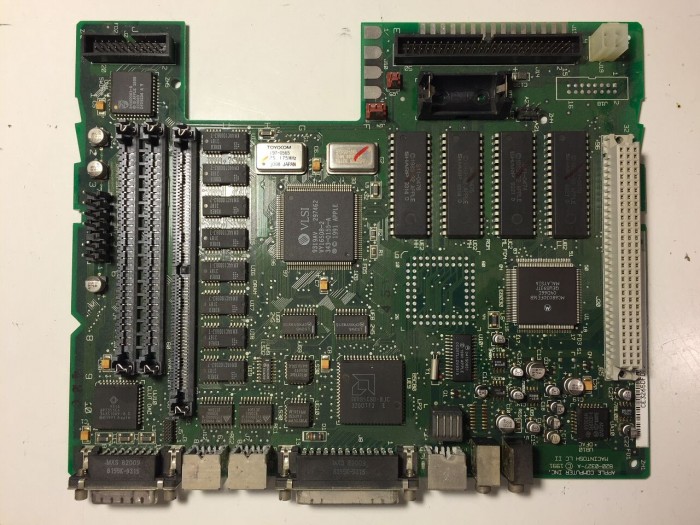Macintosh LC II/Performa 410 logic board before capacitor removal.